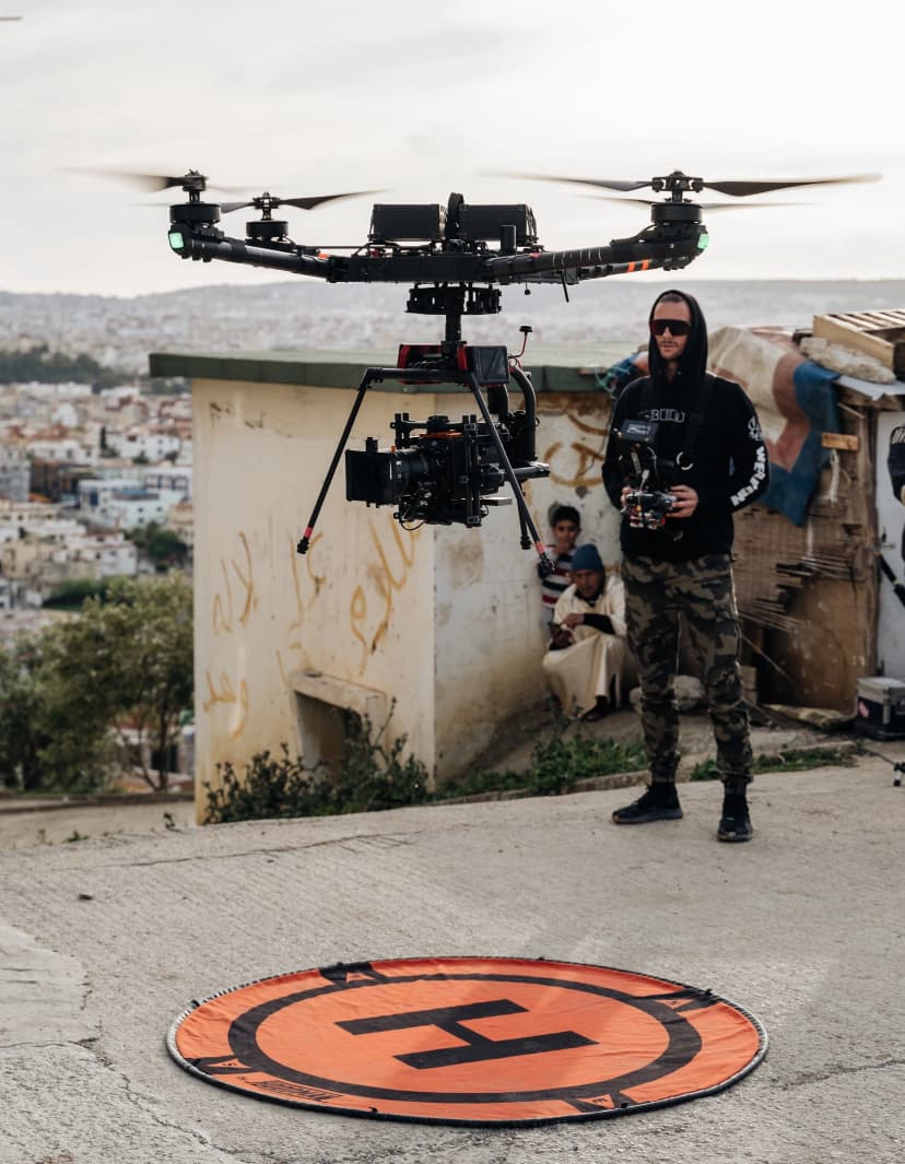 Marco flying a cinema drone on set